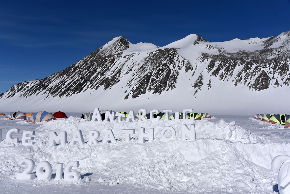 02C Ice Sign For The Antarctica Marathon 2016 At Union Glacier Antarctica With Mount Rossmann Beyond
